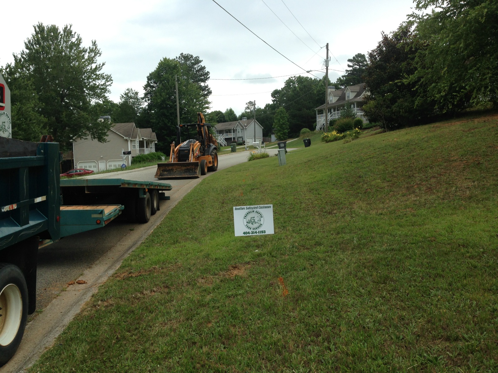 Franklin Septic Tank Service truck parked at a job site