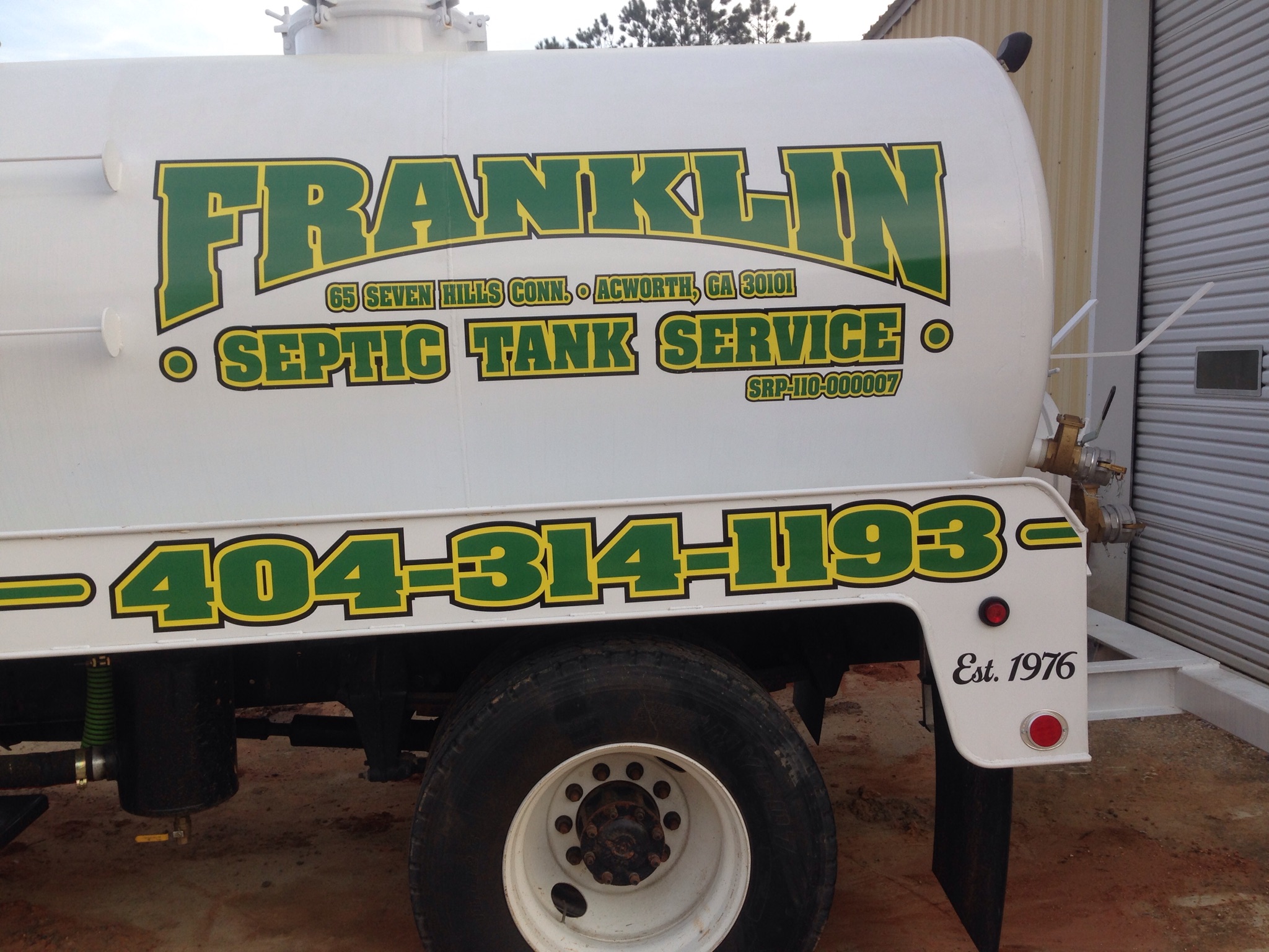 Franklin Septic crew pumping a residential tank