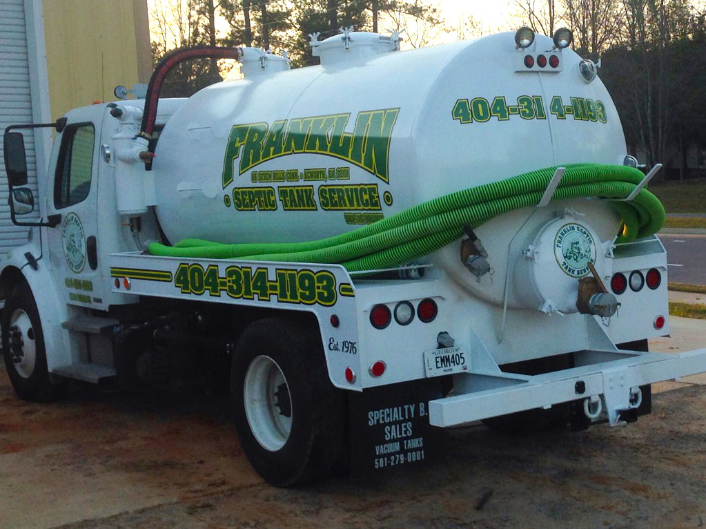 Franklin Septic Tank Service crew and equipment at a field job